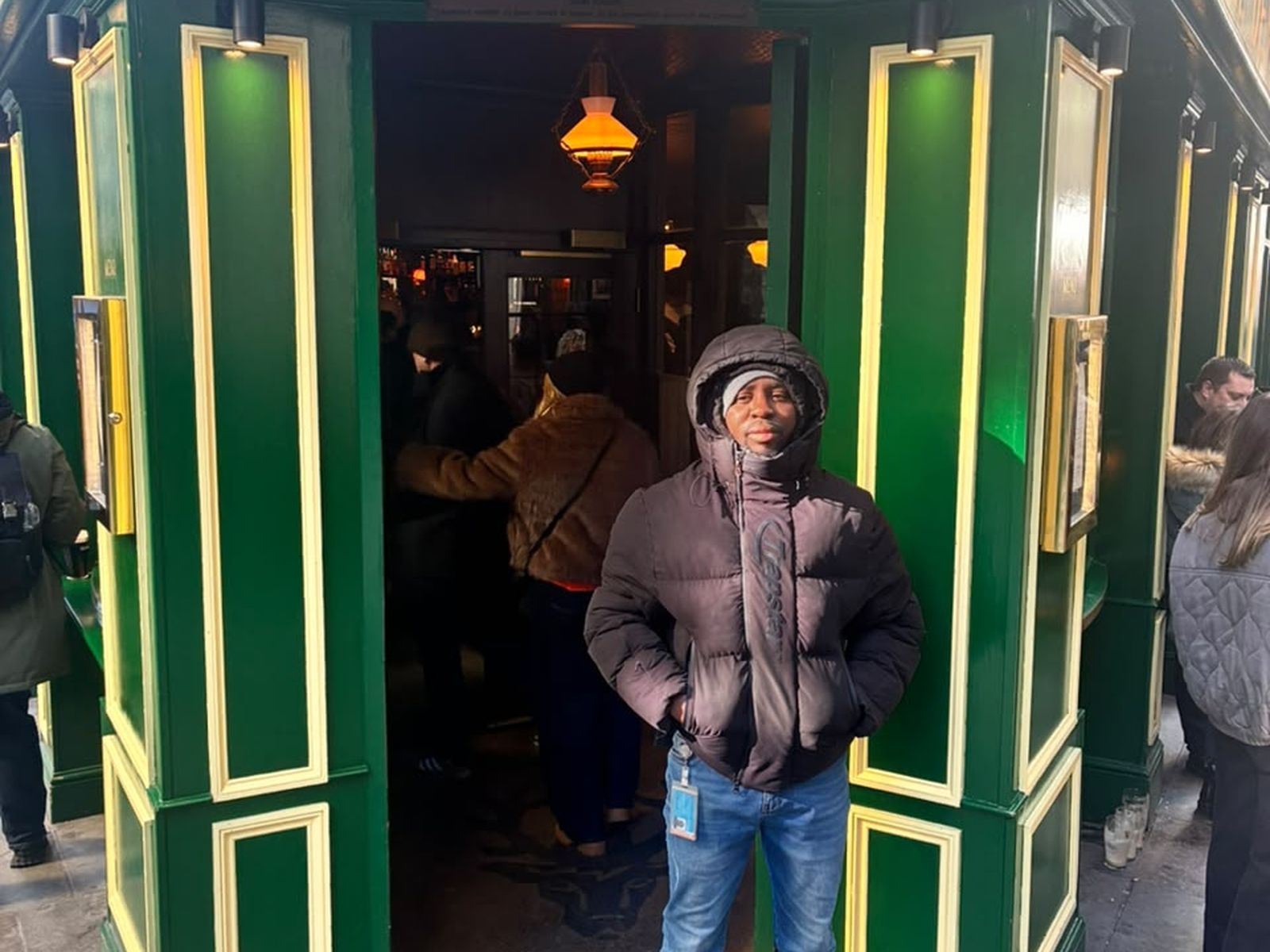 Titans by Fàdé door staff outside a busy London pub